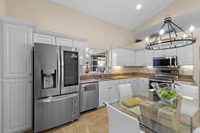 Immaculate golf course home located in the prestigious Barclay on PGA National Golf Club in Florida - for sale on GolfHomes.com, golf home, golf lot