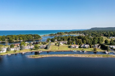 100 feet of EXCEPTIONAL LAKE FRONTAGE improved & protected with on Arcadia Bluffs Golf Club in Michigan - for sale on GolfHomes.com, golf home, golf lot