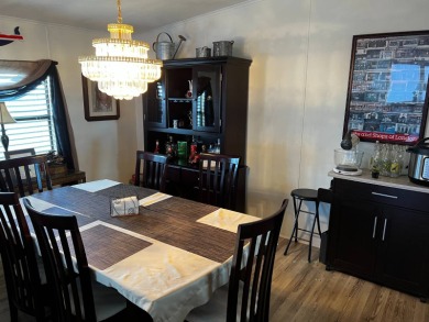 Welcome to this delightful 2-bedroom, 2-bath home where comfort on Lake Henry Golf Club in Florida - for sale on GolfHomes.com, golf home, golf lot