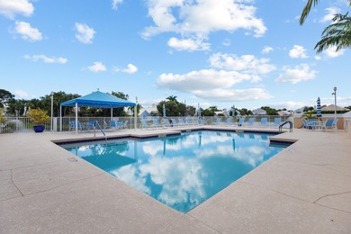 Immaculate golf course home located in the prestigious Barclay on PGA National Golf Club in Florida - for sale on GolfHomes.com, golf home, golf lot