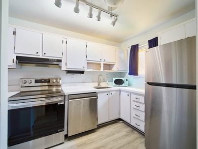 Charming 1BR/1.5BA condo overlooking the golf course in the on Miles Grant Country Club in Florida - for sale on GolfHomes.com, golf home, golf lot