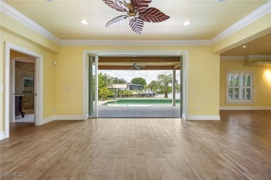 Luxury Waterfront Key West-Style Retreat on nearly 1/2 an acre on Sabal Trace Golf and Country Club in Florida - for sale on GolfHomes.com, golf home, golf lot