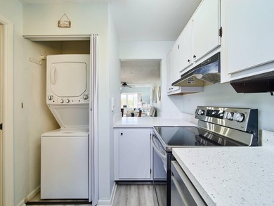 Charming 1BR/1.5BA condo overlooking the golf course in the on Miles Grant Country Club in Florida - for sale on GolfHomes.com, golf home, golf lot