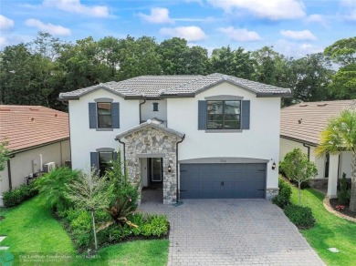 Beautifully upgraded pool home on the golf course. Boasting 4 on Woodmont Country Club in Florida - for sale on GolfHomes.com, golf home, golf lot