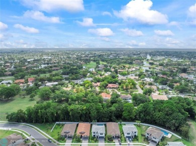 Beautifully upgraded pool home on the golf course. Boasting 4 on Woodmont Country Club in Florida - for sale on GolfHomes.com, golf home, golf lot