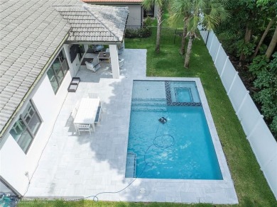 Beautifully upgraded pool home on the golf course. Boasting 4 on Woodmont Country Club in Florida - for sale on GolfHomes.com, golf home, golf lot