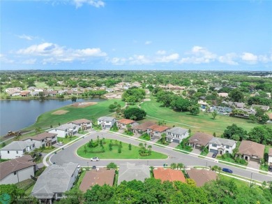 Beautifully upgraded pool home on the golf course. Boasting 4 on Woodmont Country Club in Florida - for sale on GolfHomes.com, golf home, golf lot