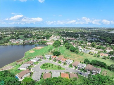 Beautifully upgraded pool home on the golf course. Boasting 4 on Woodmont Country Club in Florida - for sale on GolfHomes.com, golf home, golf lot