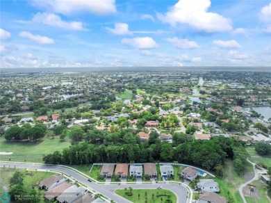 Beautifully upgraded pool home on the golf course. Boasting 4 on Woodmont Country Club in Florida - for sale on GolfHomes.com, golf home, golf lot