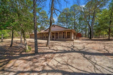 This property at Holly Lake Ranch offers a large covered front on Holly Lake Ranch Golf Club in Texas - for sale on GolfHomes.com, golf home, golf lot