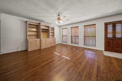 This property at Holly Lake Ranch offers a large covered front on Holly Lake Ranch Golf Club in Texas - for sale on GolfHomes.com, golf home, golf lot