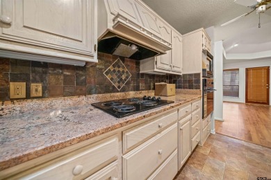 This property at Holly Lake Ranch offers a large covered front on Holly Lake Ranch Golf Club in Texas - for sale on GolfHomes.com, golf home, golf lot