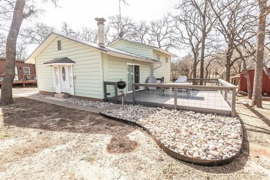 Slow down and enjoy the good with this ideal getaway or on Nocona Hills Golf Course in Texas - for sale on GolfHomes.com, golf home, golf lot