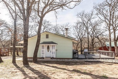 Slow down and enjoy the good with this ideal getaway or on Nocona Hills Golf Course in Texas - for sale on GolfHomes.com, golf home, golf lot