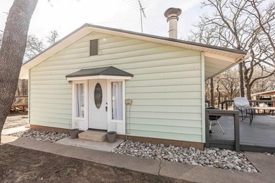 Slow down and enjoy the good with this ideal getaway or on Nocona Hills Golf Course in Texas - for sale on GolfHomes.com, golf home, golf lot