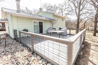 Slow down and enjoy the good with this ideal getaway or on Nocona Hills Golf Course in Texas - for sale on GolfHomes.com, golf home, golf lot