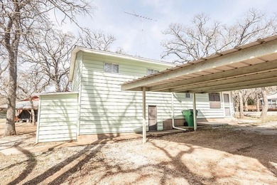 Slow down and enjoy the good with this ideal getaway or on Nocona Hills Golf Course in Texas - for sale on GolfHomes.com, golf home, golf lot