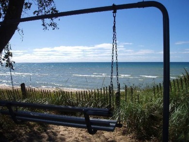 100 feet of EXCEPTIONAL LAKE FRONTAGE improved & protected with on Arcadia Bluffs Golf Club in Michigan - for sale on GolfHomes.com, golf home, golf lot