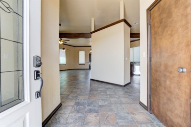Come see this beautiful 3385 sq ft home on .90 acres overlooking on Cimarron National Golf Club in Oklahoma - for sale on GolfHomes.com, golf home, golf lot
