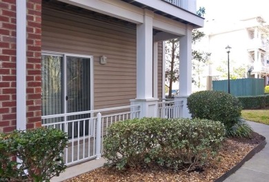 Welcome home to this stylish and modern first-floor end unit on Cypress Point Country Club in Virginia - for sale on GolfHomes.com, golf home, golf lot