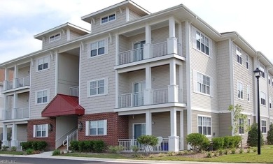 Welcome home to this stylish and modern first-floor end unit on Cypress Point Country Club in Virginia - for sale on GolfHomes.com, golf home, golf lot