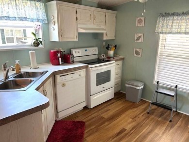 Discover this beautifully maintained 2-bedroom, 2-bathroom home on Crystal Lake Club in Florida - for sale on GolfHomes.com, golf home, golf lot