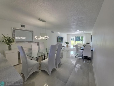 STUNNINGLY REMODELED 2BR/2BA CONDO, REIMAGINED WITH NO EXPENSE on Wynmoor Golf Course in Florida - for sale on GolfHomes.com, golf home, golf lot