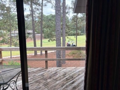 This two-bedroom townhome is located on the 12th hole of on Pinehurst  No. 6 Golf Course in North Carolina - for sale on GolfHomes.com, golf home, golf lot