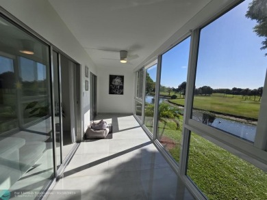STUNNINGLY REMODELED 2BR/2BA CONDO, REIMAGINED WITH NO EXPENSE on Wynmoor Golf Course in Florida - for sale on GolfHomes.com, golf home, golf lot