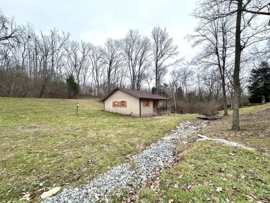 Welcome to your perfect little getaway! This charming cottage on Carnico Golf Course in Kentucky - for sale on GolfHomes.com, golf home, golf lot