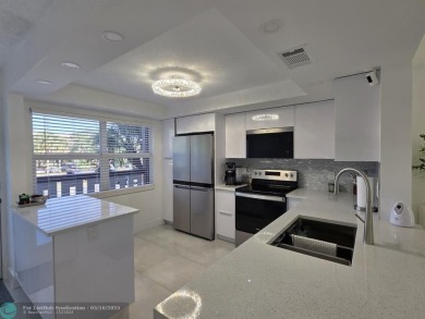 STUNNINGLY REMODELED 2BR/2BA CONDO, REIMAGINED WITH NO EXPENSE on Wynmoor Golf Course in Florida - for sale on GolfHomes.com, golf home, golf lot