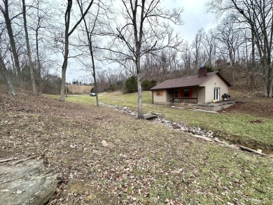 Welcome to your perfect little getaway! This charming cottage on Carnico Golf Course in Kentucky - for sale on GolfHomes.com, golf home, golf lot