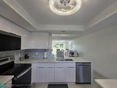 STUNNINGLY REMODELED 2BR/2BA CONDO, REIMAGINED WITH NO EXPENSE on Wynmoor Golf Course in Florida - for sale on GolfHomes.com, golf home, golf lot