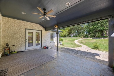 Welcome to a beautifully maintained stone home nestled in a on De Cordova Bend Country Club in Texas - for sale on GolfHomes.com, golf home, golf lot
