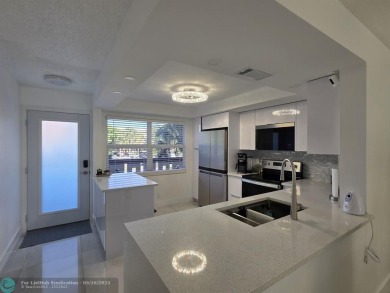STUNNINGLY REMODELED 2BR/2BA CONDO, REIMAGINED WITH NO EXPENSE on Wynmoor Golf Course in Florida - for sale on GolfHomes.com, golf home, golf lot