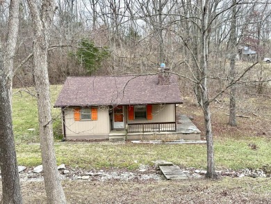 Welcome to your perfect little getaway! This charming cottage on Carnico Golf Course in Kentucky - for sale on GolfHomes.com, golf home, golf lot