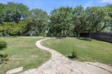 Welcome to a beautifully maintained stone home nestled in a on De Cordova Bend Country Club in Texas - for sale on GolfHomes.com, golf home, golf lot