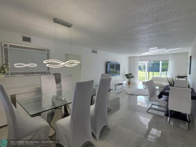 STUNNINGLY REMODELED 2BR/2BA CONDO, REIMAGINED WITH NO EXPENSE on Wynmoor Golf Course in Florida - for sale on GolfHomes.com, golf home, golf lot