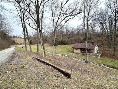 Welcome to your perfect little getaway! This charming cottage on Carnico Golf Course in Kentucky - for sale on GolfHomes.com, golf home, golf lot