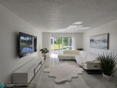 STUNNINGLY REMODELED 2BR/2BA CONDO, REIMAGINED WITH NO EXPENSE on Wynmoor Golf Course in Florida - for sale on GolfHomes.com, golf home, golf lot