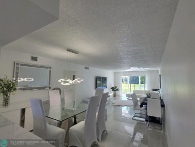 STUNNINGLY REMODELED 2BR/2BA CONDO, REIMAGINED WITH NO EXPENSE on Wynmoor Golf Course in Florida - for sale on GolfHomes.com, golf home, golf lot