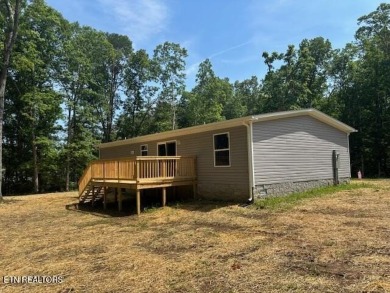 LOOK-BRAND NEW 2025 DOUBLE WIDE ON A CONCRETE BLOCK FOUNDATION on Lake Tansi Village Country Club in Tennessee - for sale on GolfHomes.com, golf home, golf lot