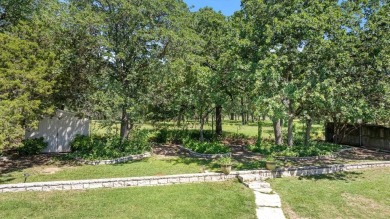 Welcome to a beautifully maintained stone home nestled in a on De Cordova Bend Country Club in Texas - for sale on GolfHomes.com, golf home, golf lot