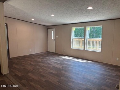 LOOK-BRAND NEW 2025 DOUBLE WIDE ON A CONCRETE BLOCK FOUNDATION on Lake Tansi Village Country Club in Tennessee - for sale on GolfHomes.com, golf home, golf lot