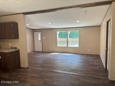 LOOK-BRAND NEW 2025 DOUBLE WIDE ON A CONCRETE BLOCK FOUNDATION on Lake Tansi Village Country Club in Tennessee - for sale on GolfHomes.com, golf home, golf lot