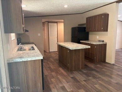 LOOK-BRAND NEW 2025 DOUBLE WIDE ON A CONCRETE BLOCK FOUNDATION on Lake Tansi Village Country Club in Tennessee - for sale on GolfHomes.com, golf home, golf lot