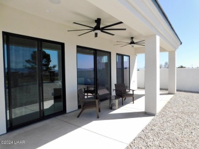 Introducing a pristine, newly constructed modern home along the on Los Lagos Golf Club in Arizona - for sale on GolfHomes.com, golf home, golf lot