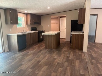 LOOK-BRAND NEW 2025 DOUBLE WIDE ON A CONCRETE BLOCK FOUNDATION on Lake Tansi Village Country Club in Tennessee - for sale on GolfHomes.com, golf home, golf lot