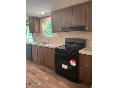 LOOK-BRAND NEW 2025 DOUBLE WIDE ON A CONCRETE BLOCK FOUNDATION on Lake Tansi Village Country Club in Tennessee - for sale on GolfHomes.com, golf home, golf lot