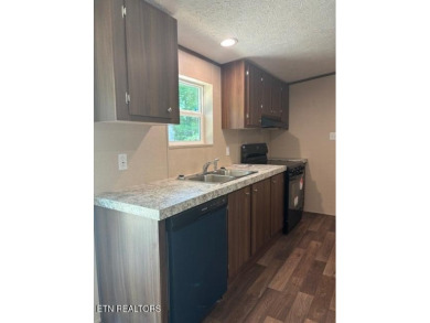 LOOK-BRAND NEW 2025 DOUBLE WIDE ON A CONCRETE BLOCK FOUNDATION on Lake Tansi Village Country Club in Tennessee - for sale on GolfHomes.com, golf home, golf lot